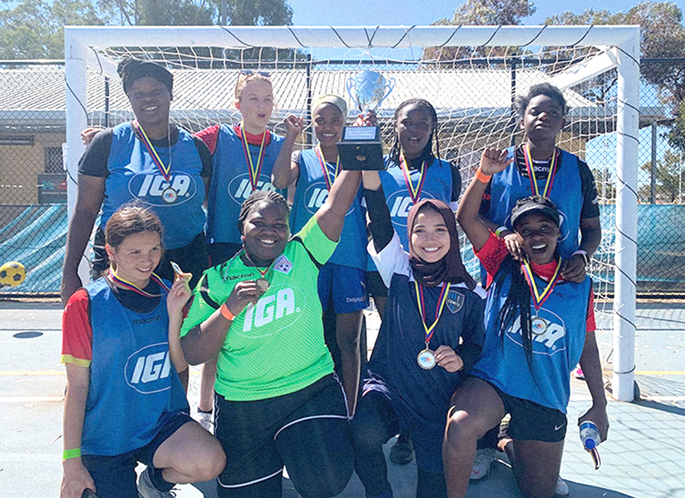 Photograph of the women's soccer team.