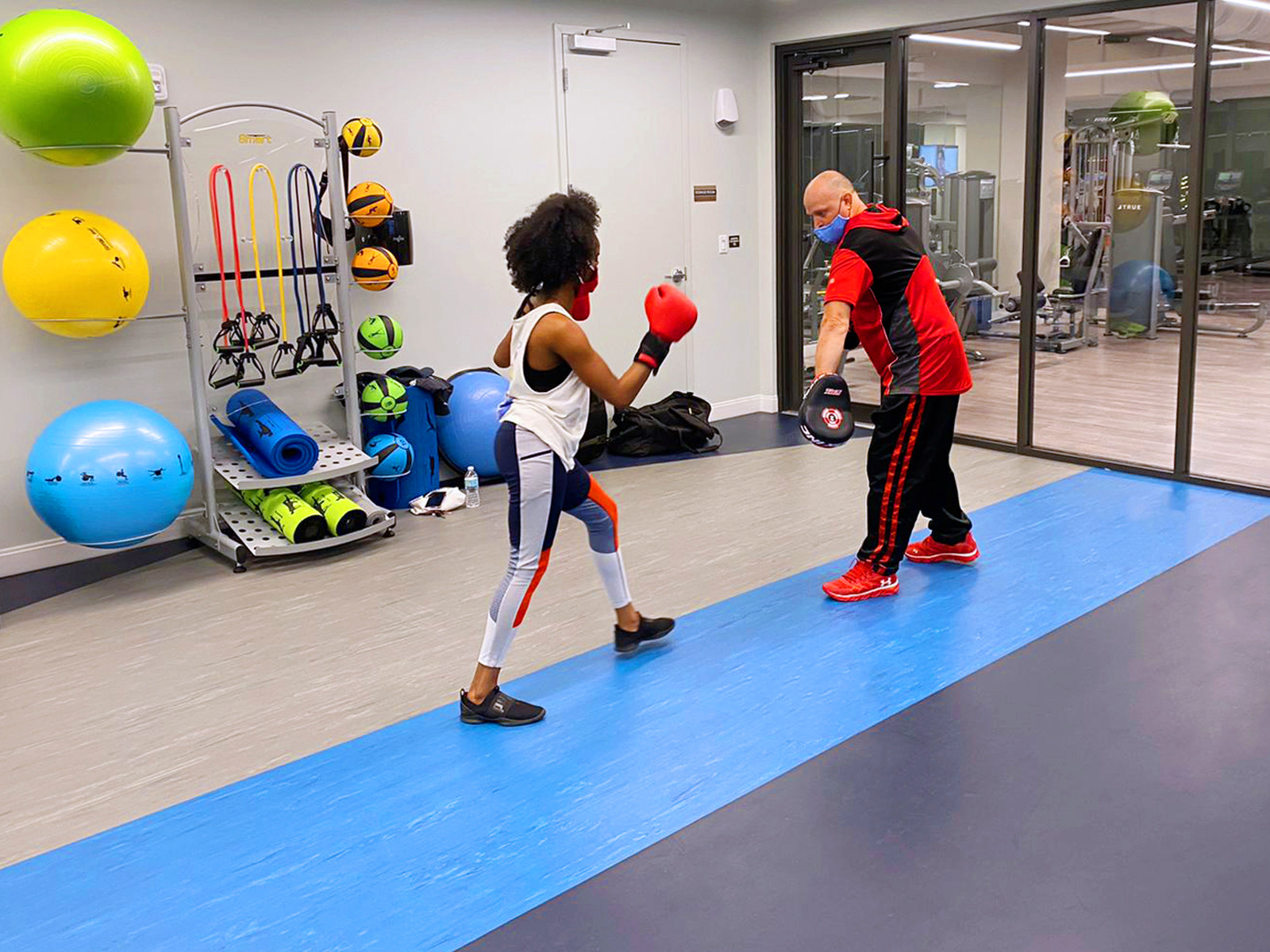 professor and student practicing kickboxing at sanctuary doral