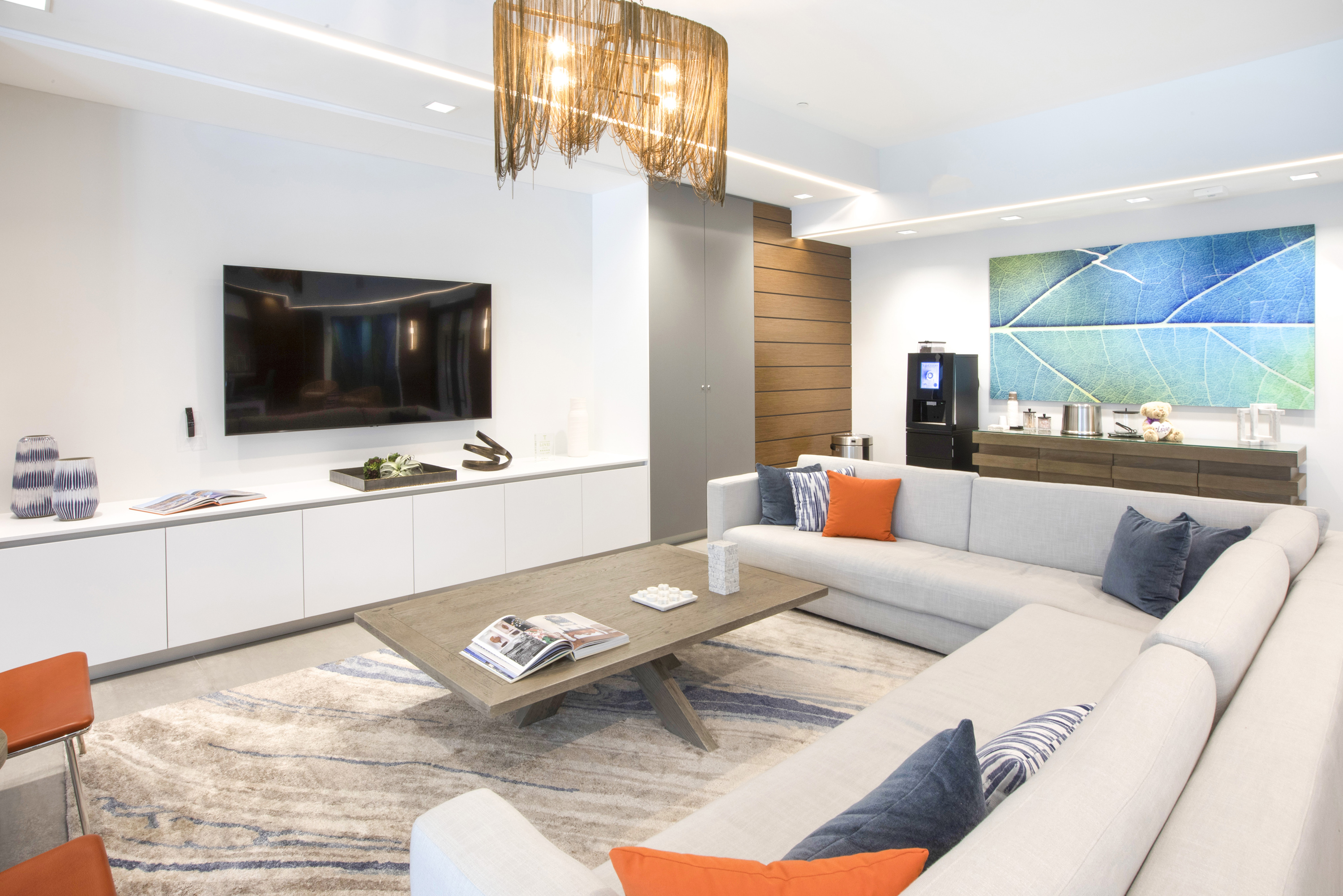 Clubroom tv, couch, coffee table and coffee machine