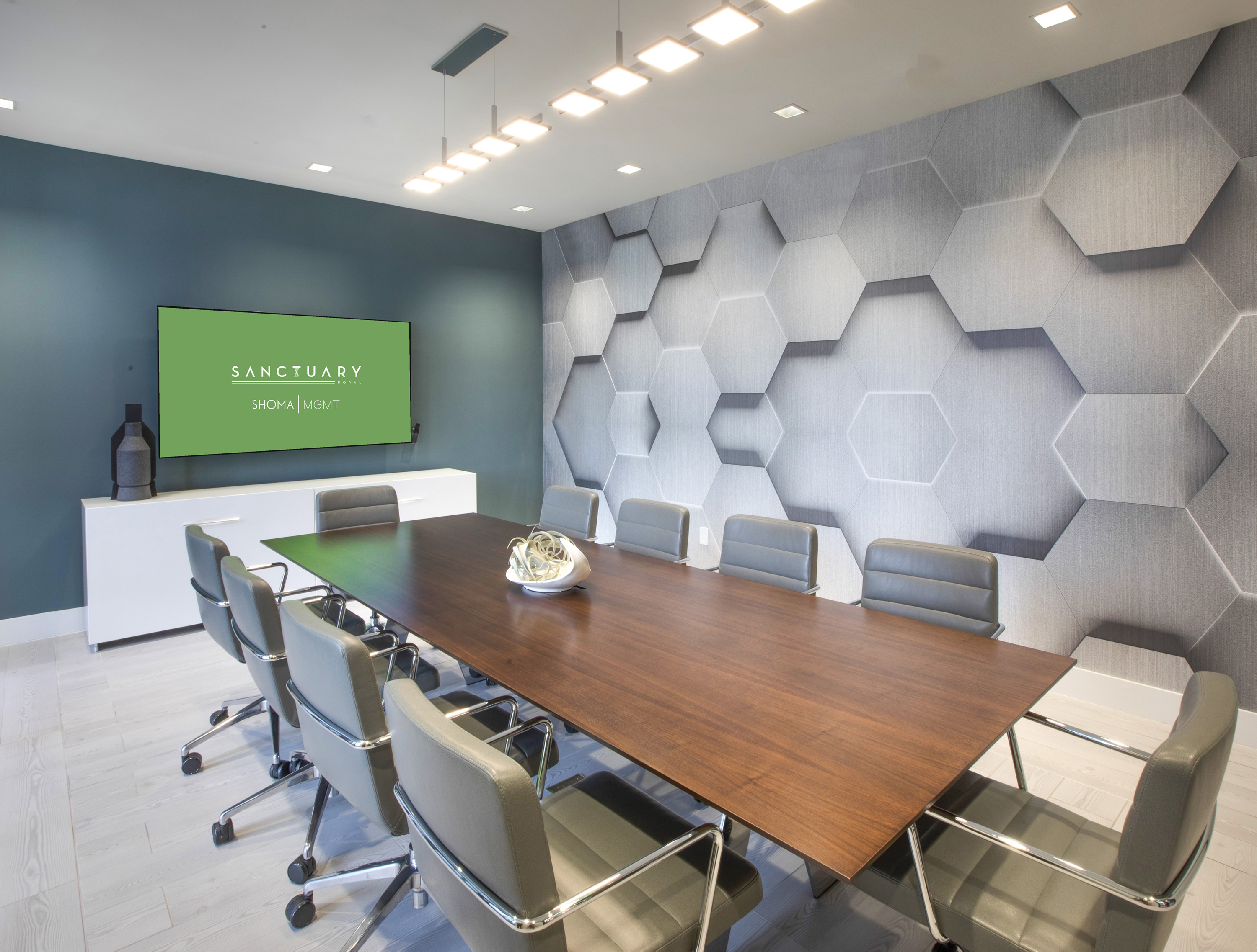 Conference room wooden table and office chairs