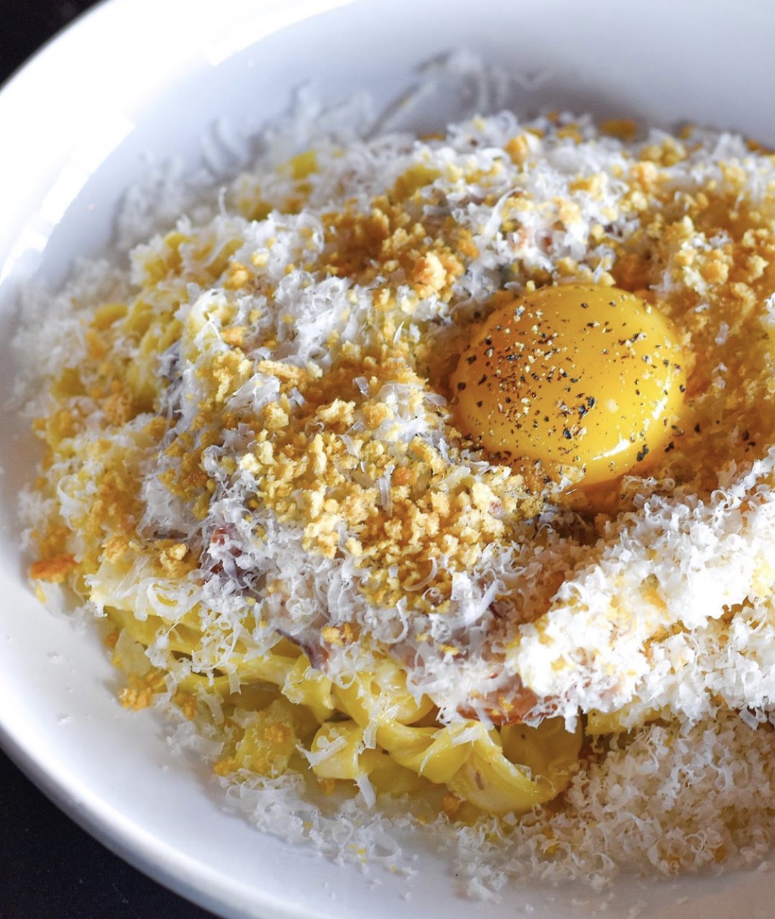 Carbonara Pasta serve with a Egg on top