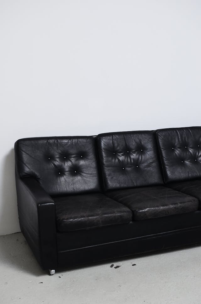 weather black leather couch