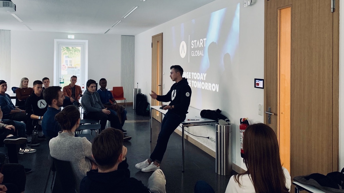 START Munich member presenting in front of other members