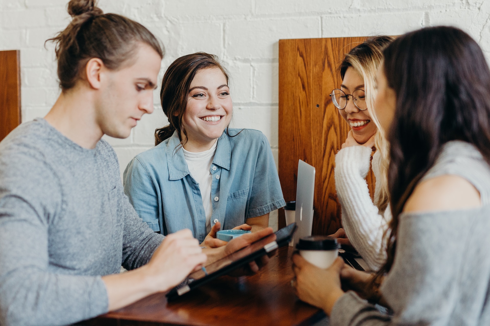 A team of four people working at a table