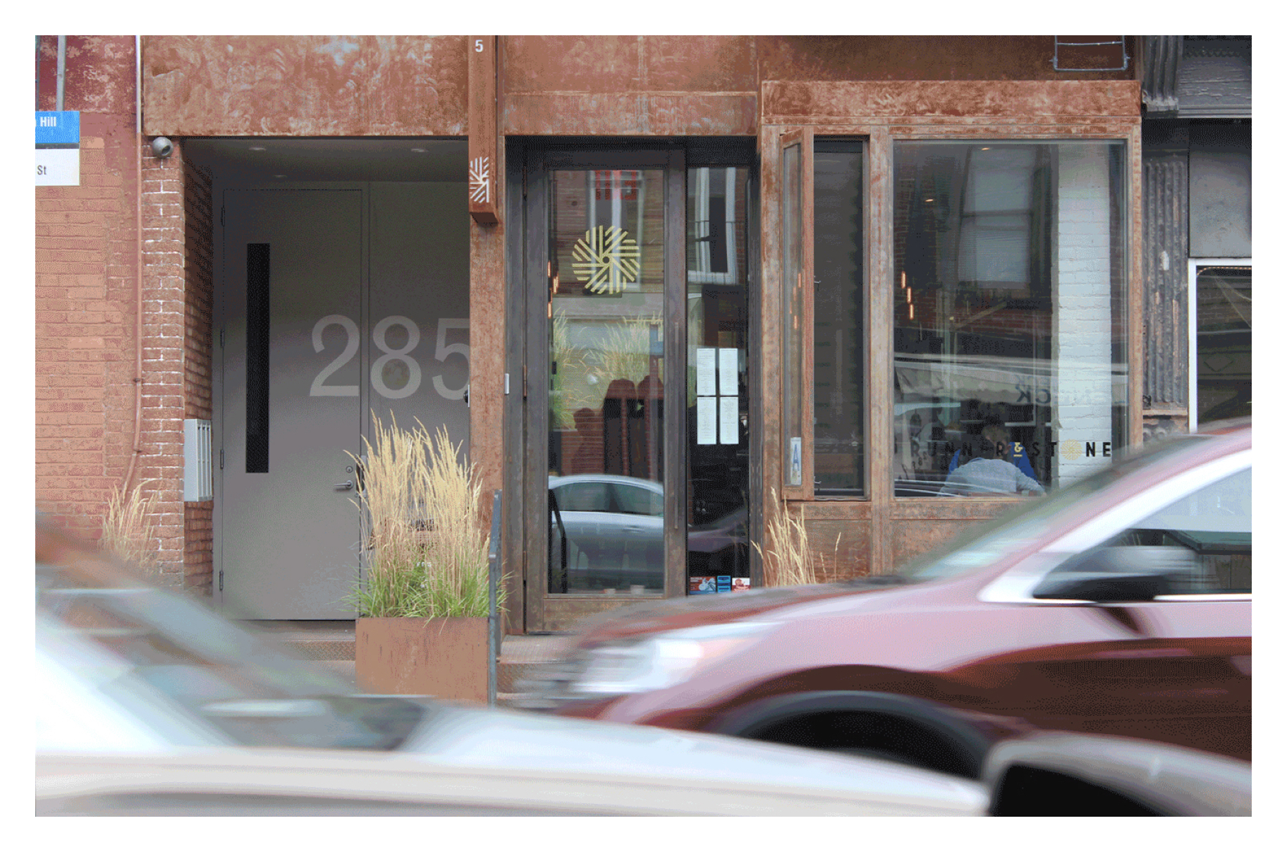 Runner & Stone storefront with branding on door and window.