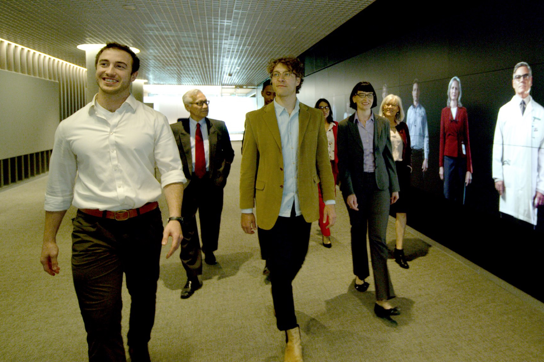 Visitors walking through experience center