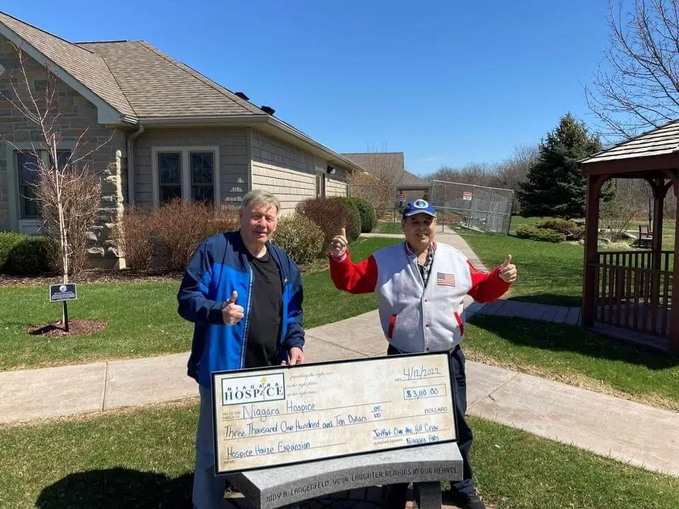 JetPort "On The Hill" crew presents a check for the Hospice House Residental expansion.