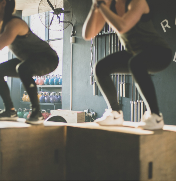 People performing a box jump
