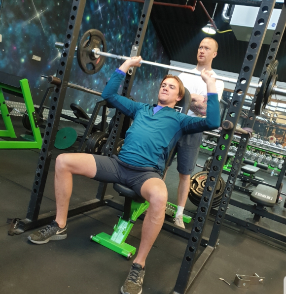 Person performing an overhead press