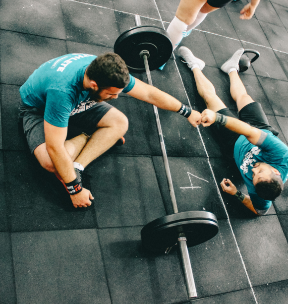 Friends first bumping in the gym