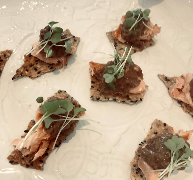 Lavosh, hot smoked salmon, caper raisin puree.