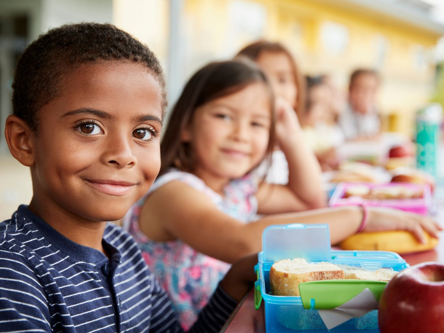 Happy kids wiith lunchboxes