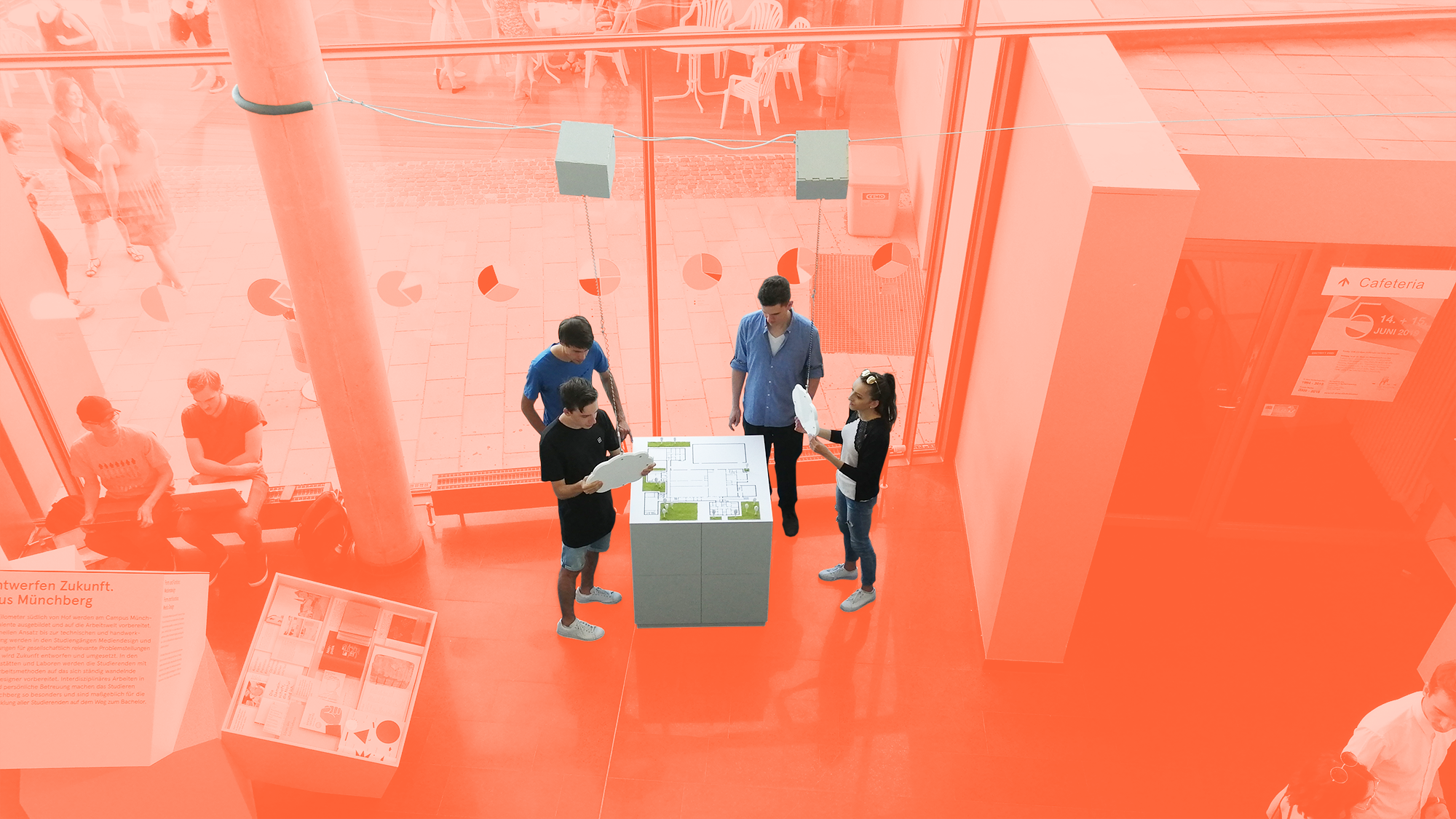 An image of the exhibit at the exhibition while four students while four students are using it.