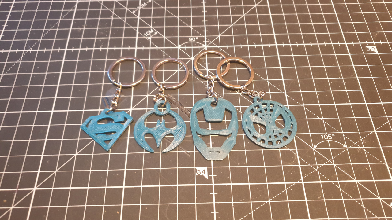 The four superhero keychains made by FORMBYTE
