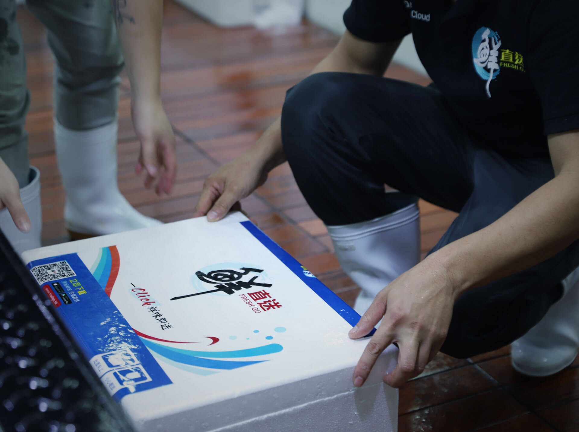 Freshgo staff with uniform packing the product