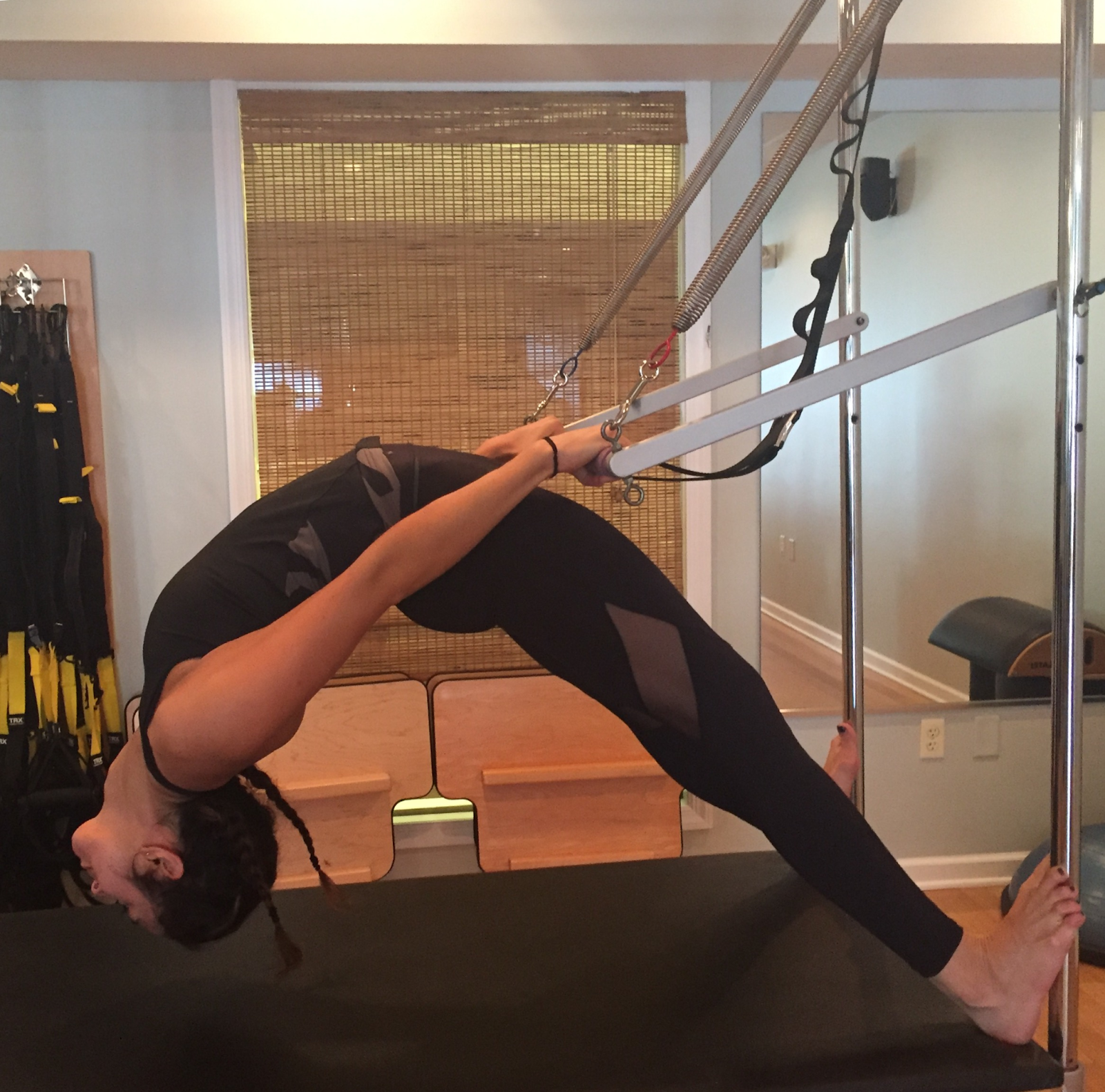 woman at a pilates machines