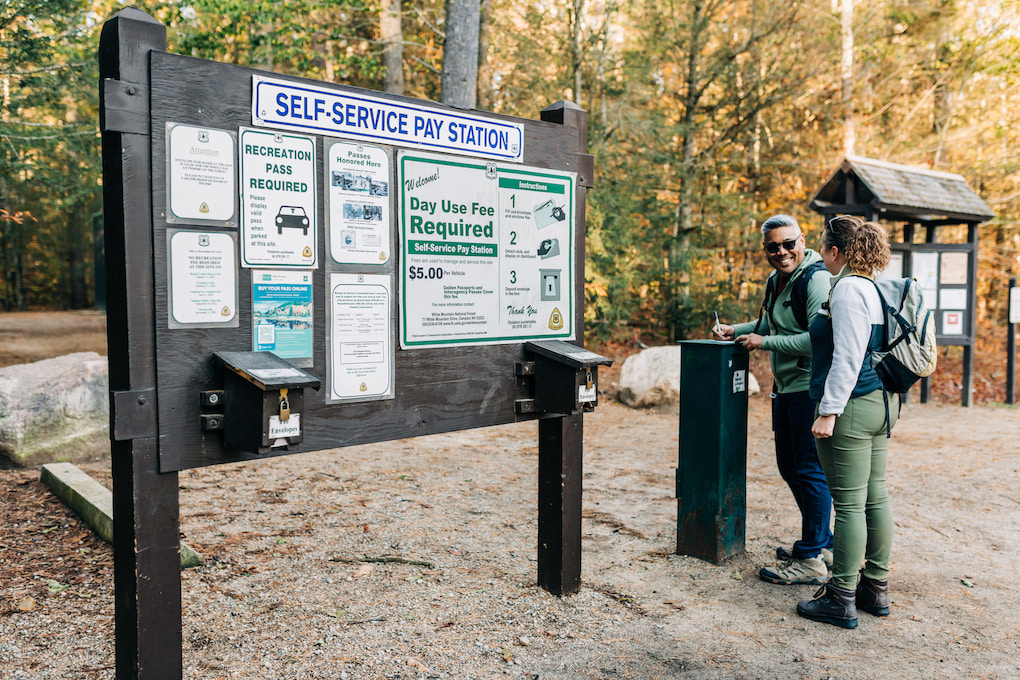 man and woman wearing backpacks new hampshire