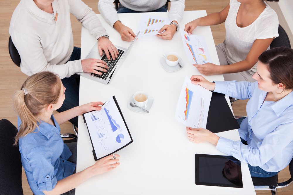 group of people discussing content analytics