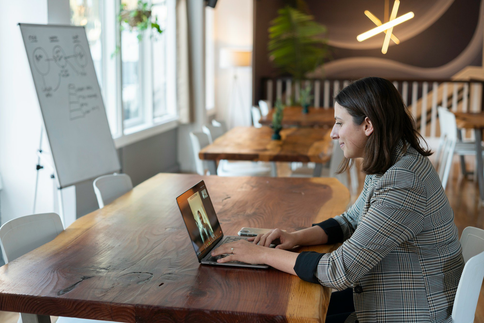 woman conducting a virtual in-home sales meeting