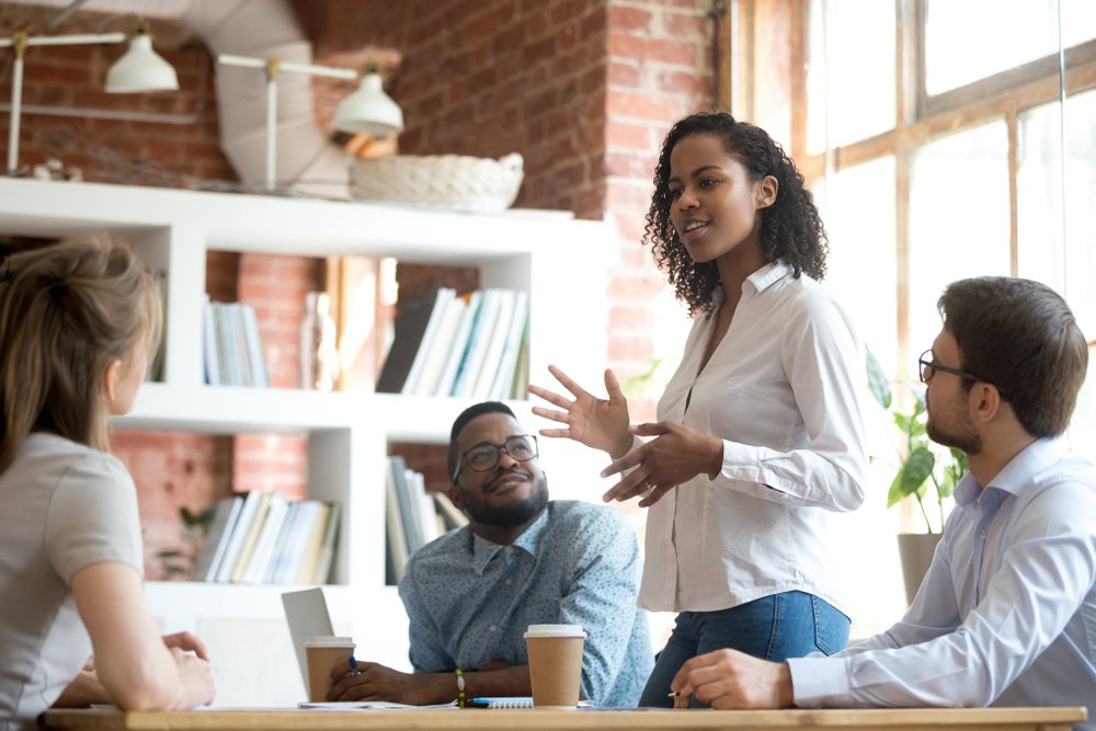 Young woman giving a sales presentation to increase sales performance