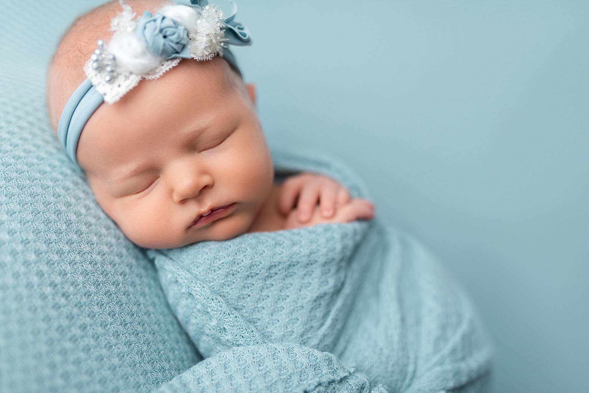 A sleeping newborn baby