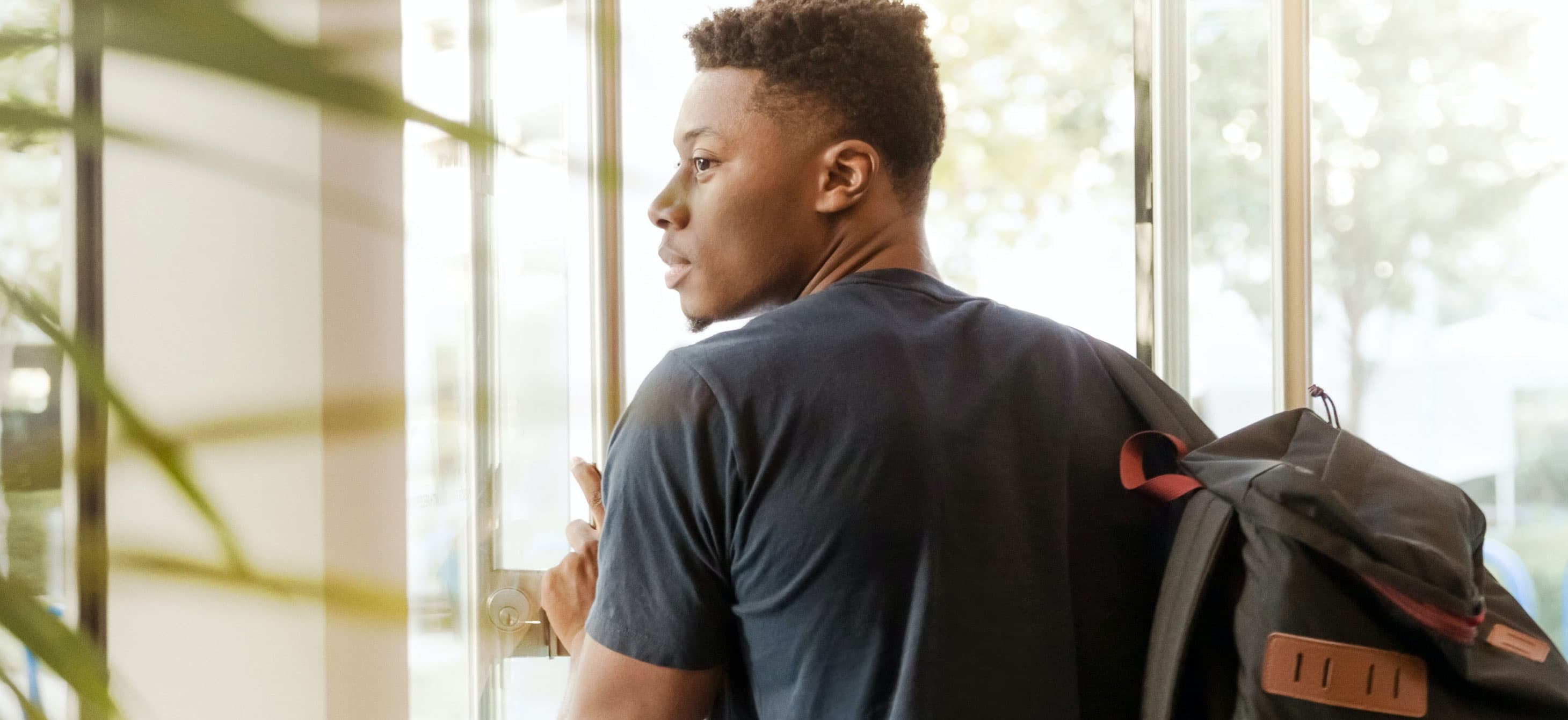 a Black student with a backpack