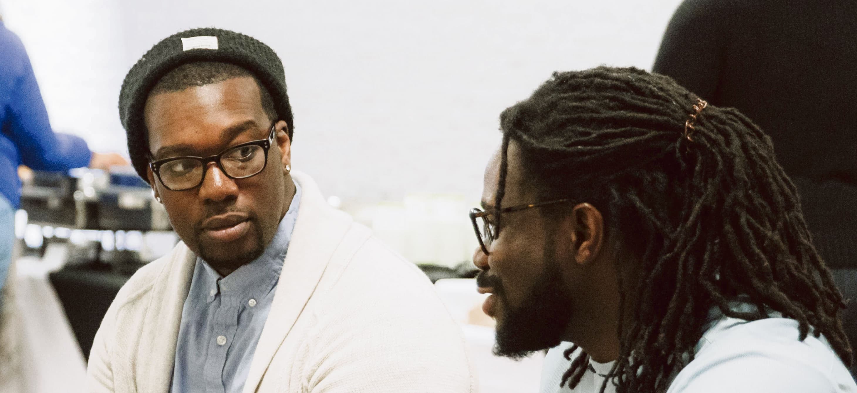 two Black men in conversation