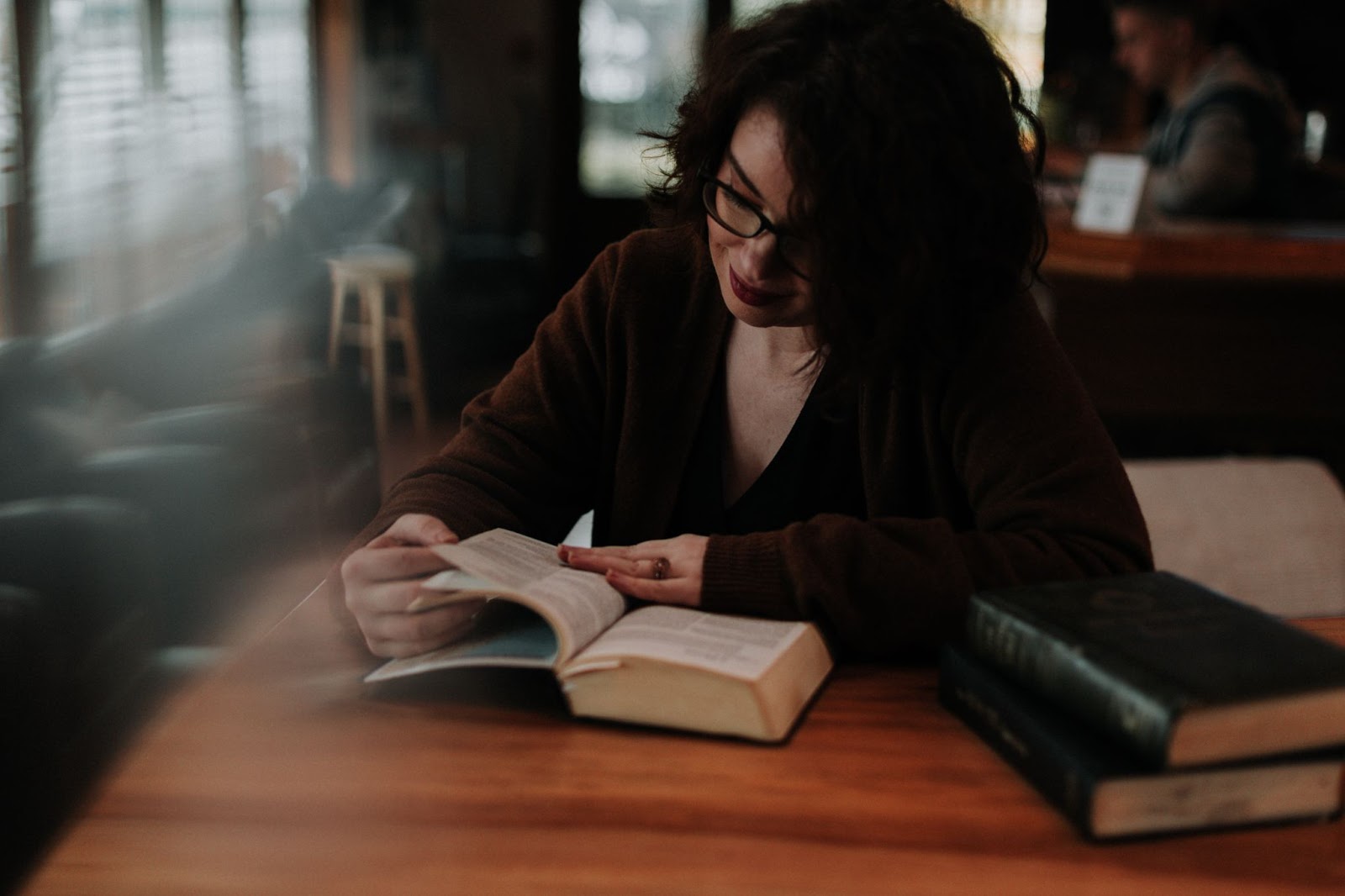 Woman reading scriptures in a cafe