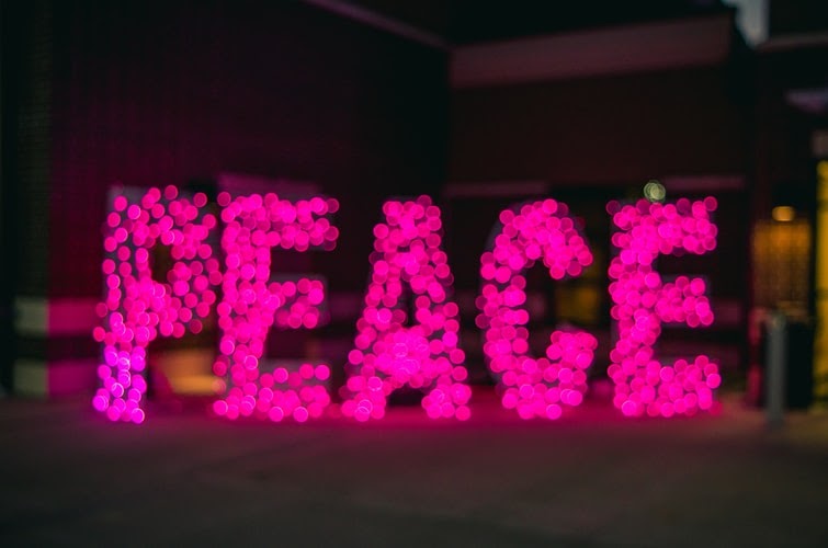 The word peace spelled out in lights