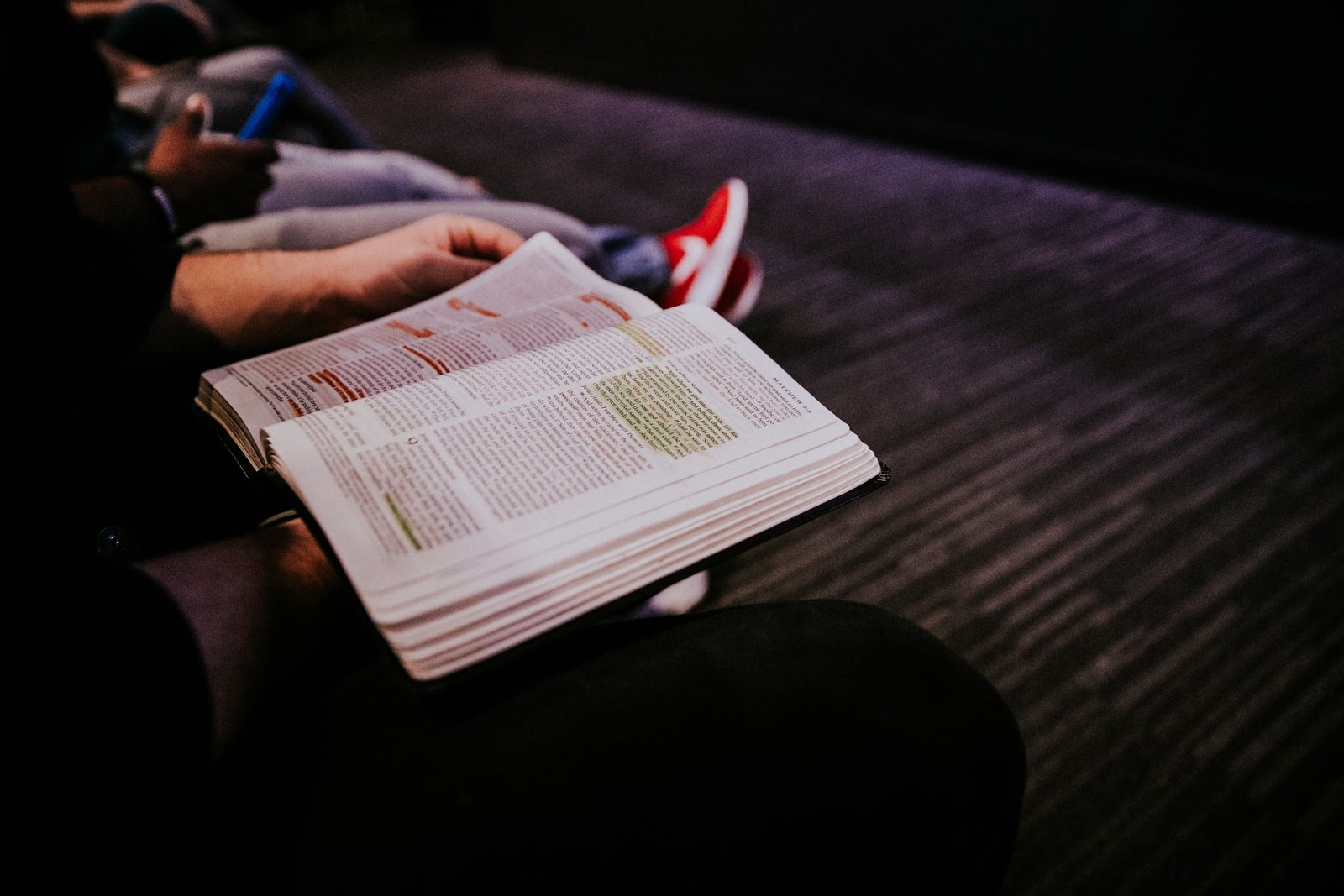a person reading a Bible