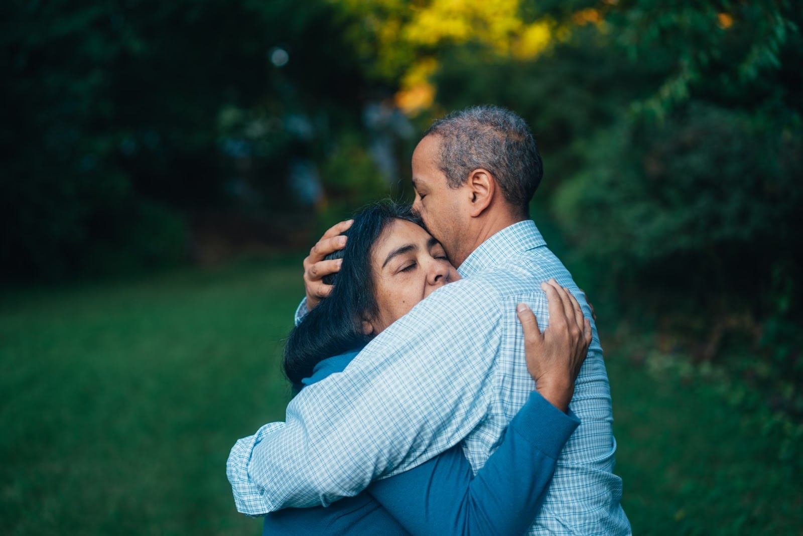 man hugging a woman