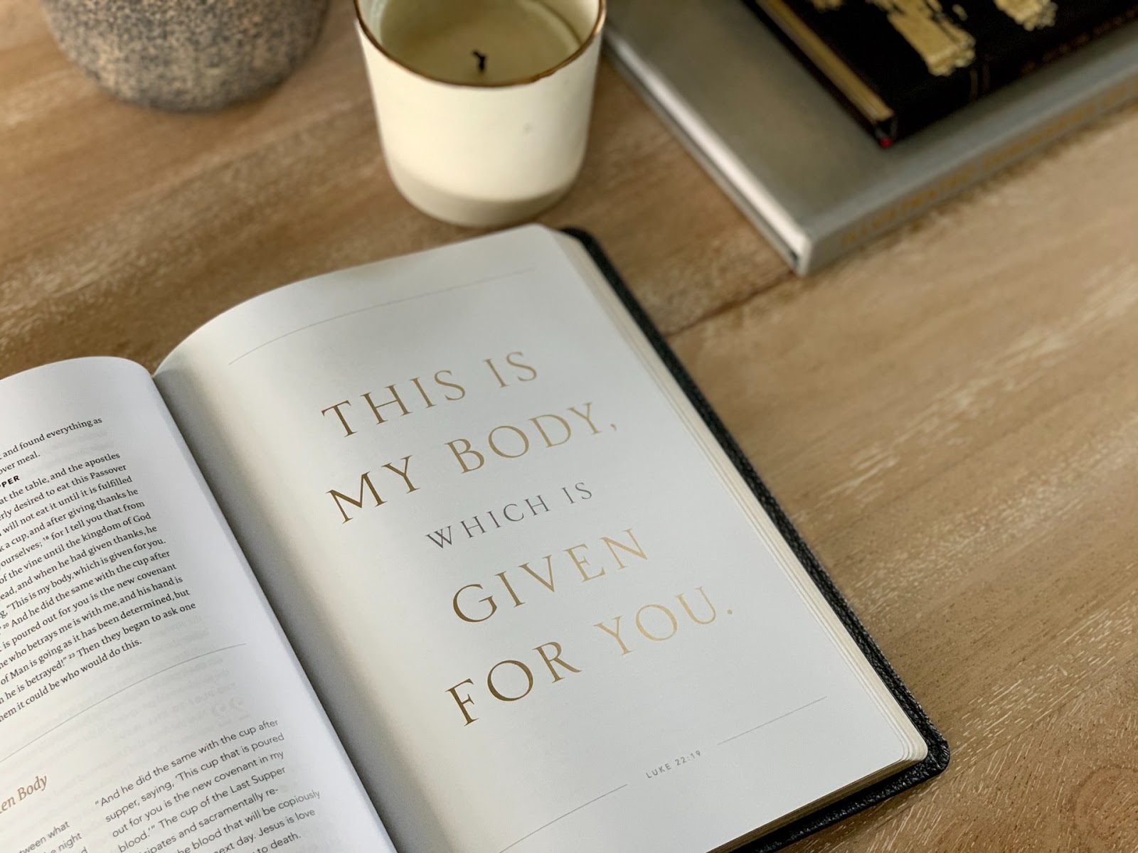 A book open on a table that says "This is my body which is given for you"