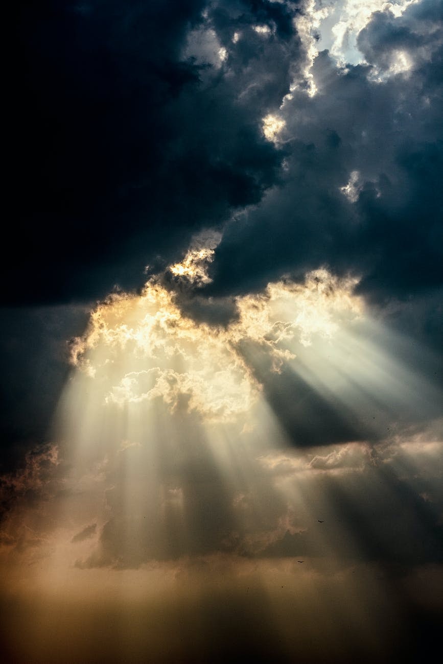 Light coming through a dark and cloudy sky.