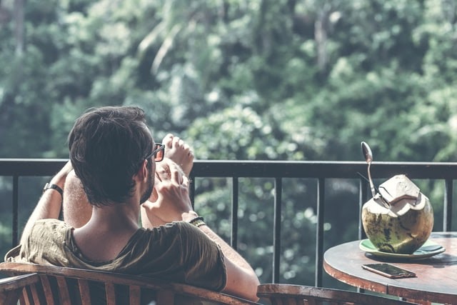 Man relaxing on balcony