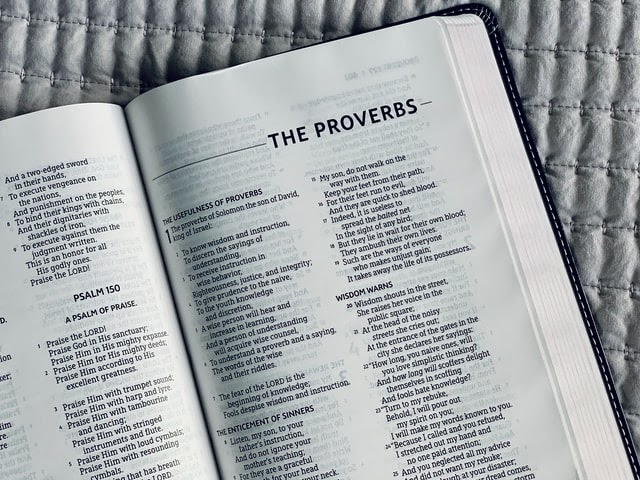Bible pages open to The Proverbs