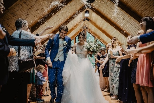 Bride and Groom walking down aisle