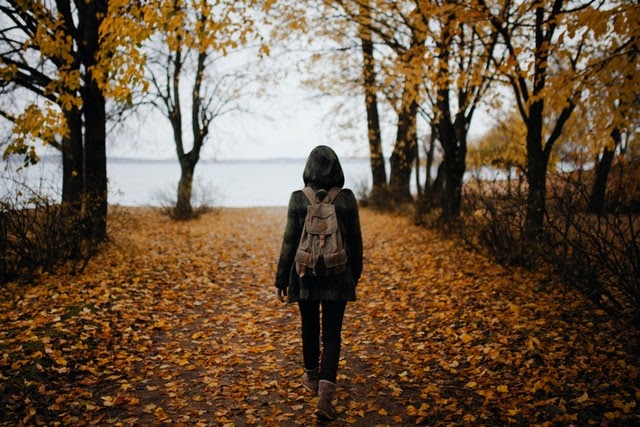 Woman walking in forest