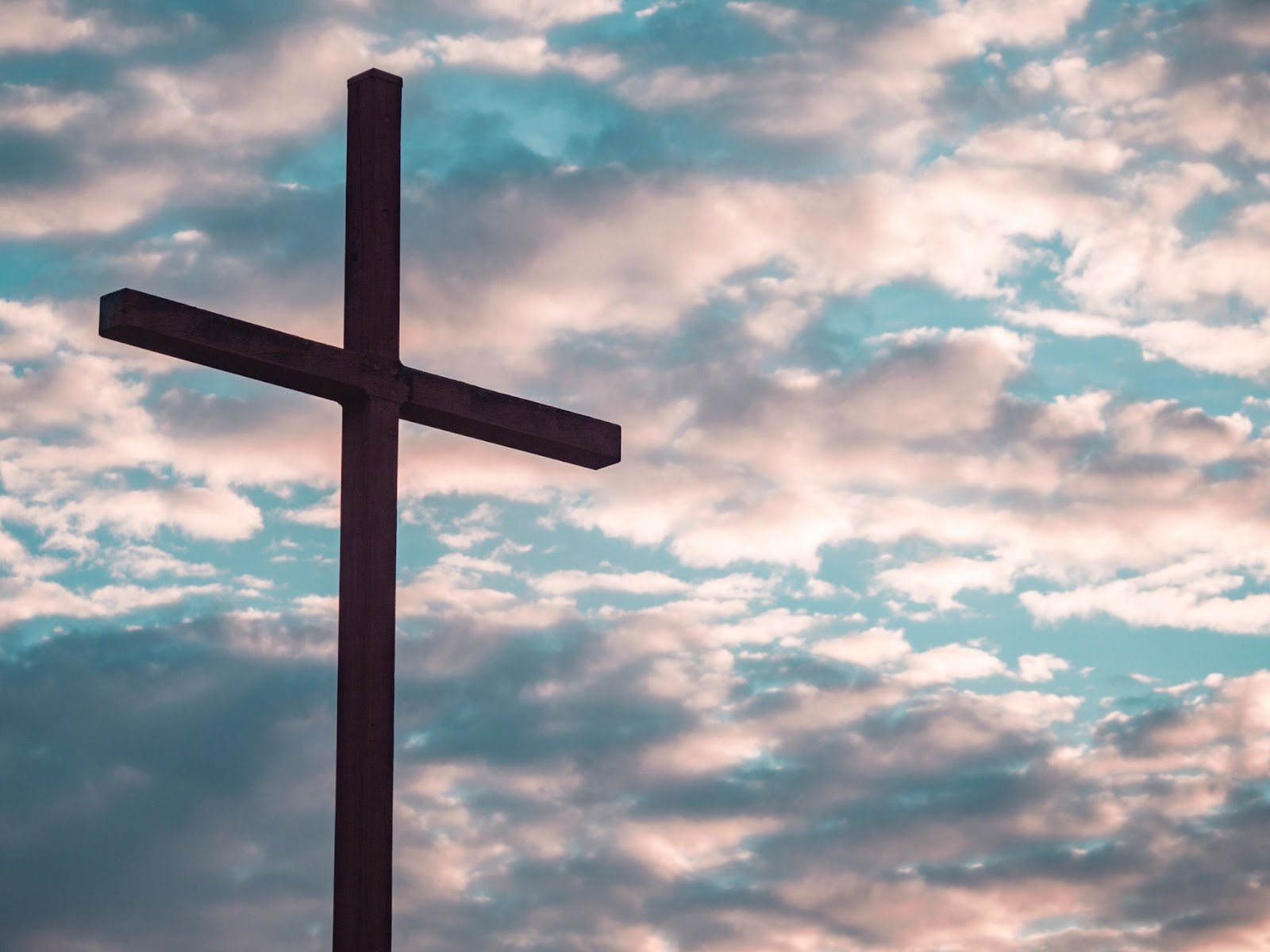 Cross against a bright and cloudy sky