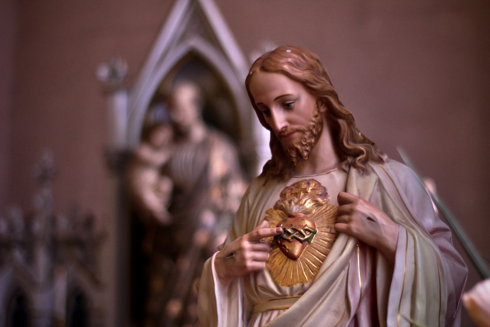 a statuette of Jesus with a heart on his chest