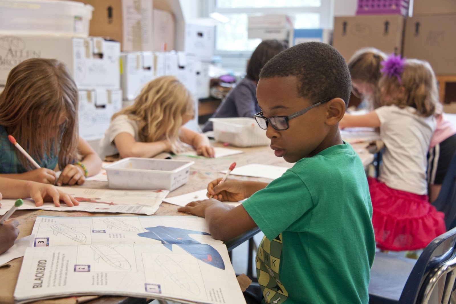Classroom of young students performing work