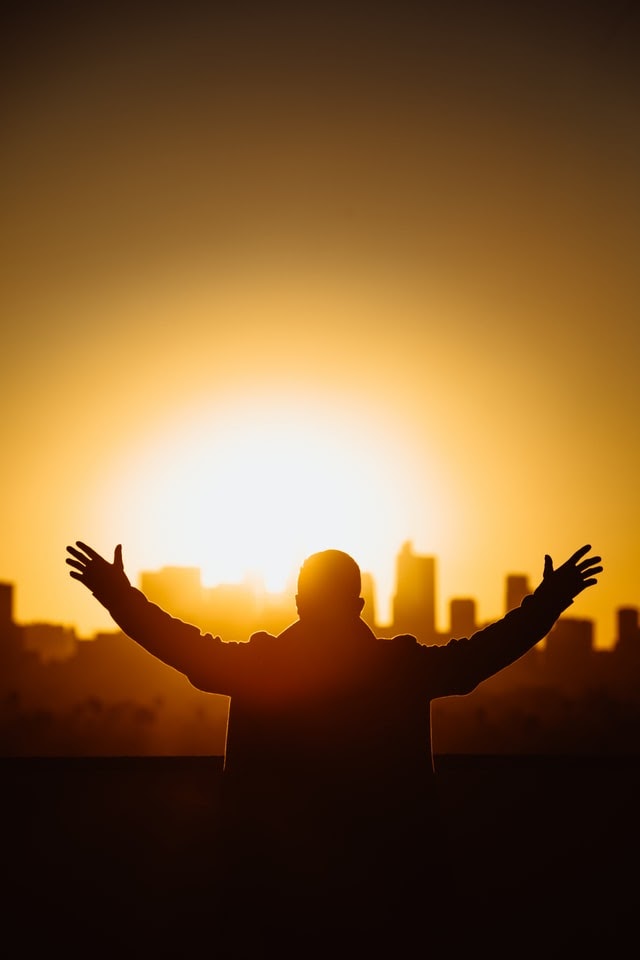 Man with hands outstretched in worship