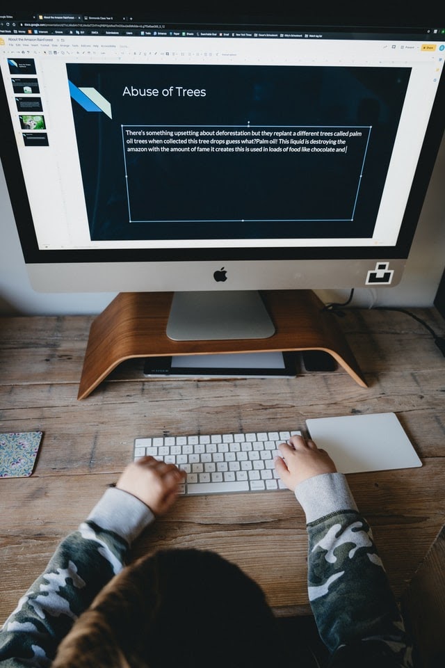 Boy completing school assignment at home