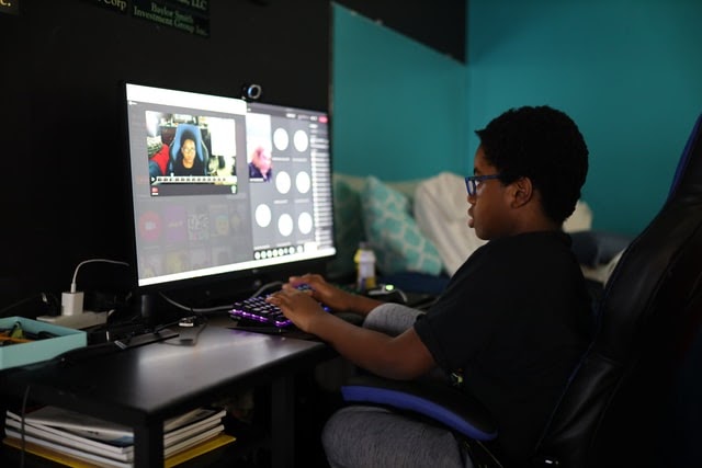 Boy attending virtual class from home
