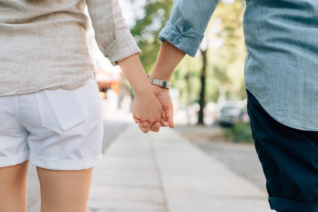 Dating couple holding hands