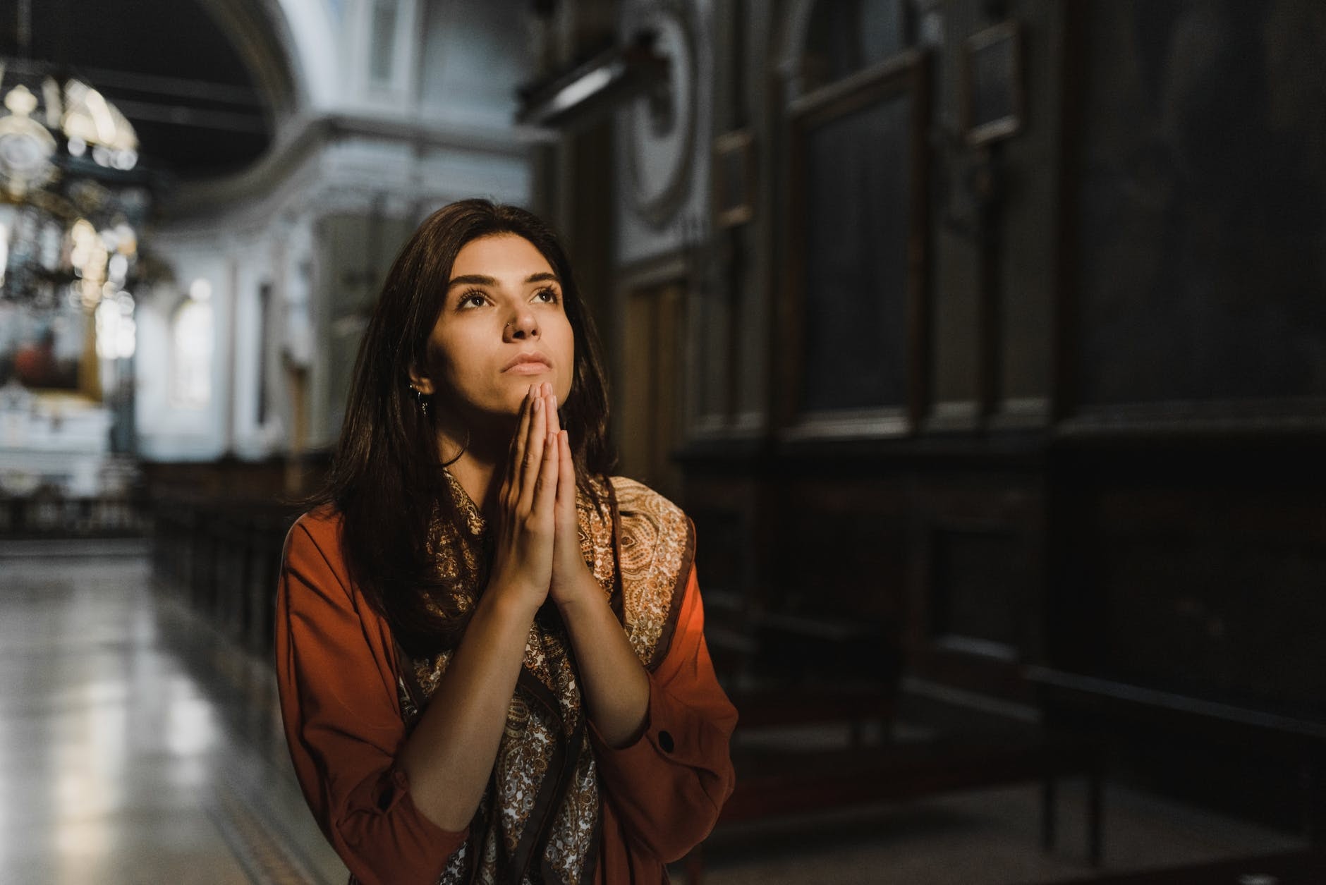 Woman praying in church