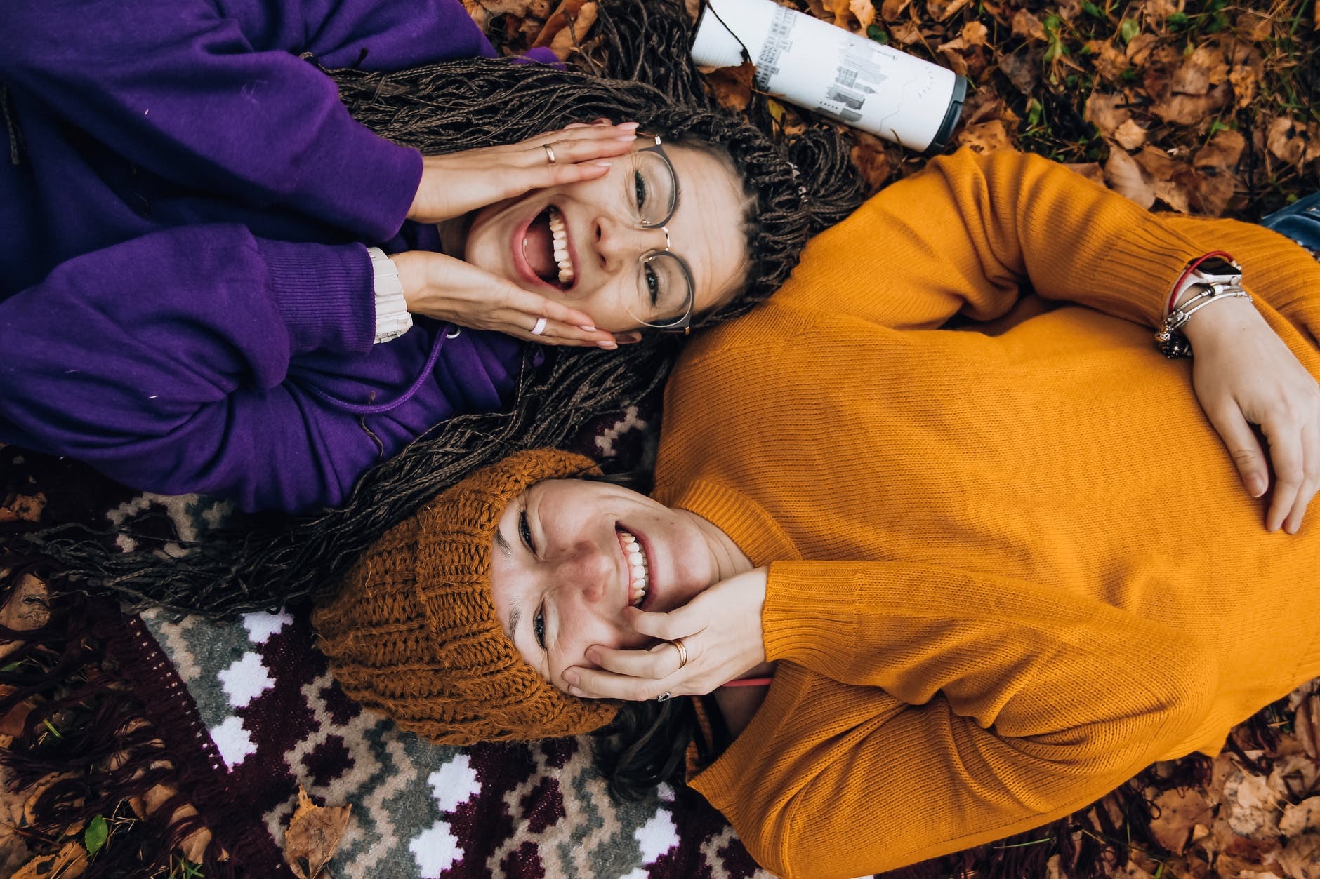 Two girls smiling and looking up.