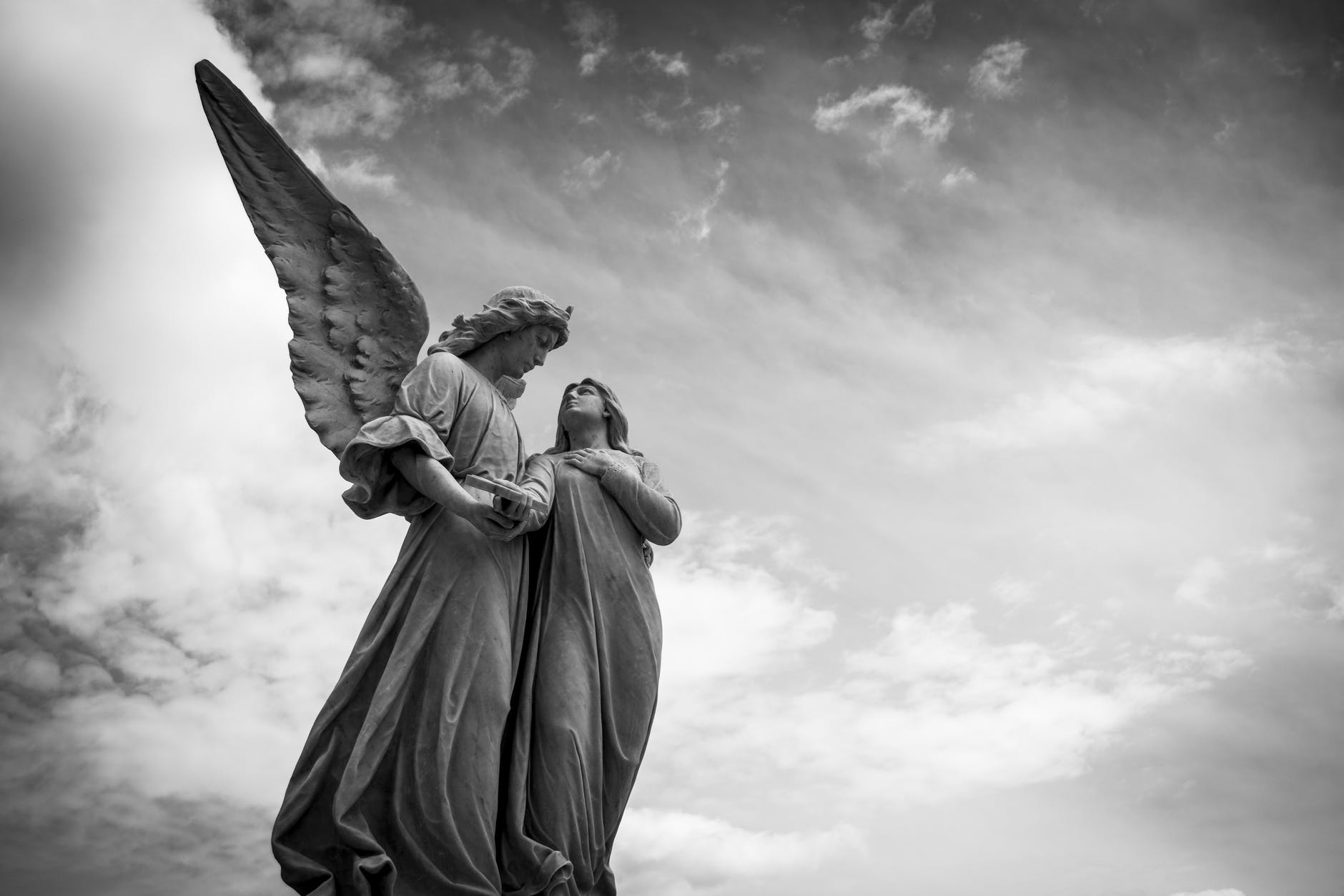 Statue of an angel and a woman