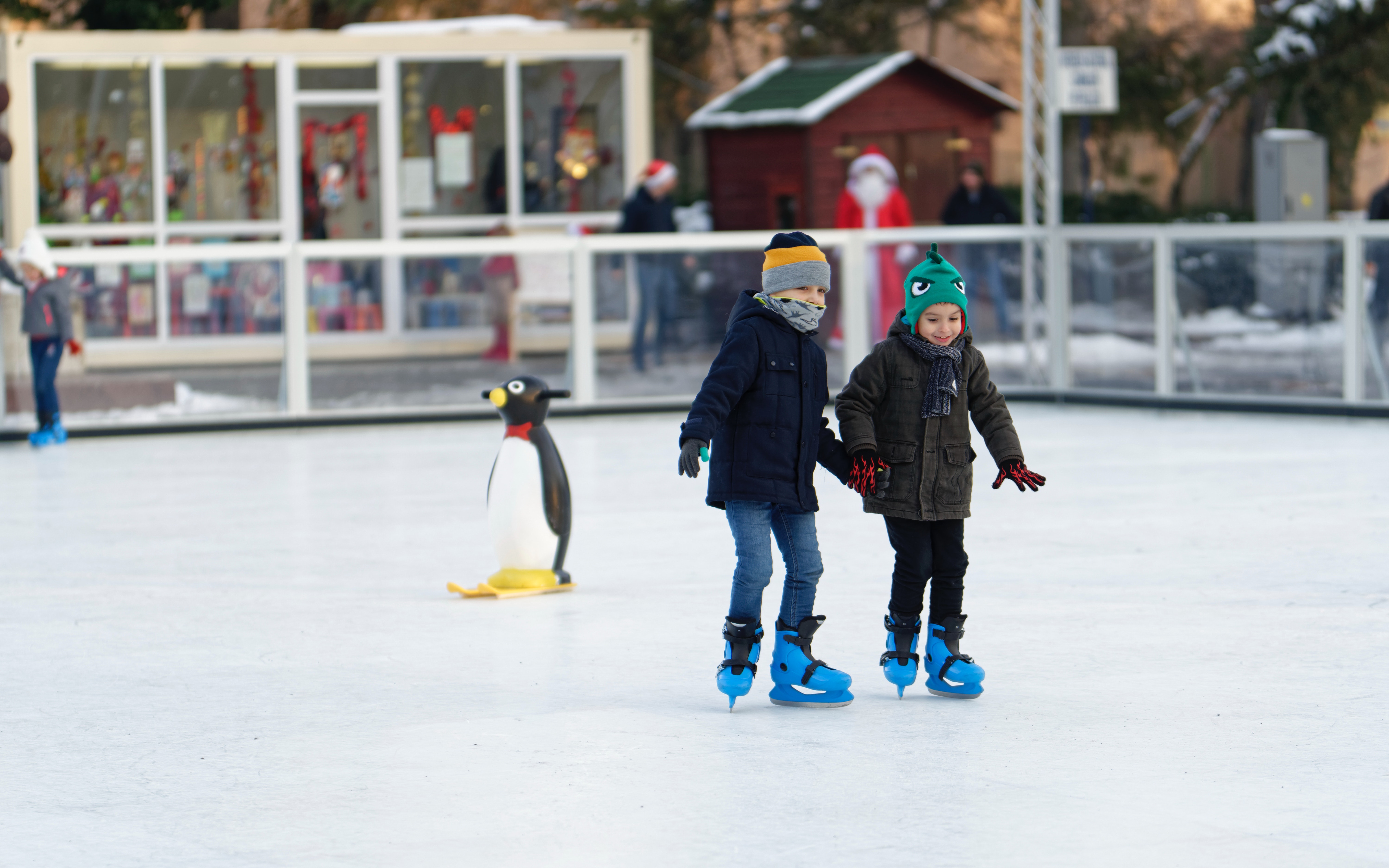 two children inside of ice skating field 1722444