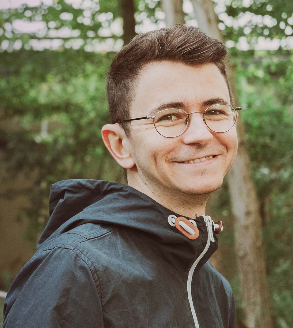 a photo of vit opravil smiling outside