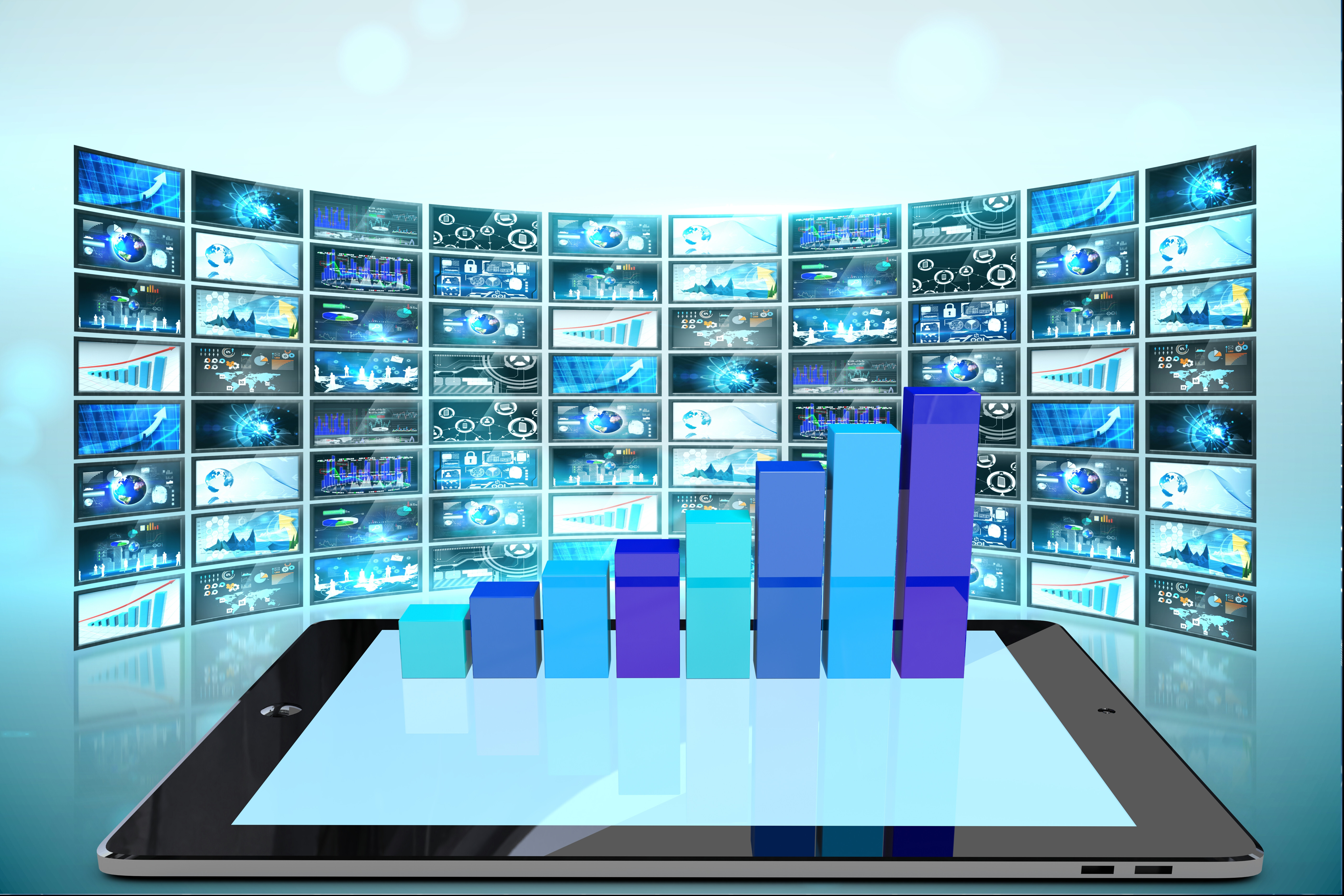 A tablet screen showing increasing bar graph with several screens in its background
